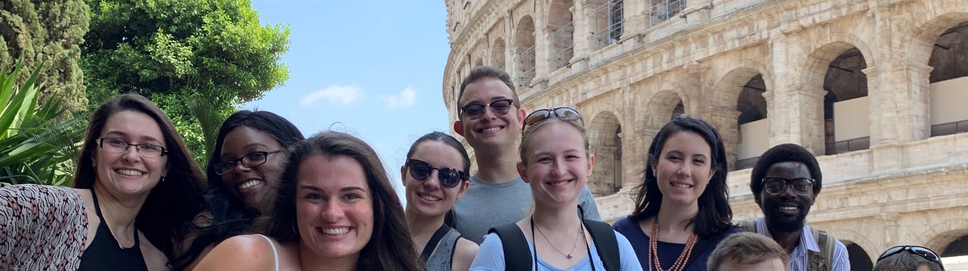 Group of Harford students in  front of Coliseum in Rome, Italy