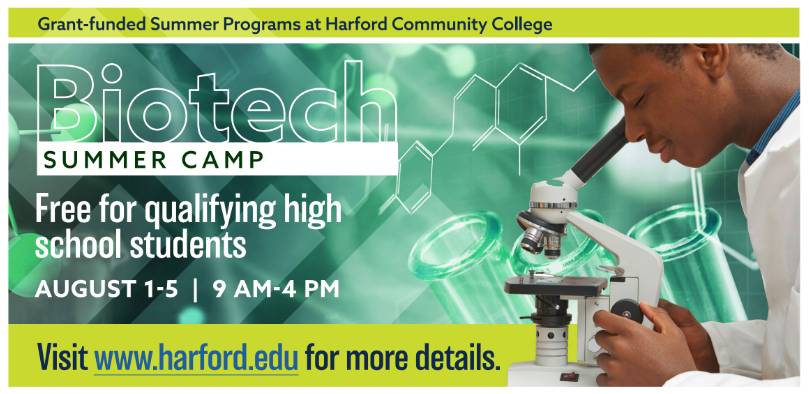 teen in lab coat at microscope - ad for Biotech Summer Camp